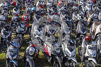 Motorbike parking on the street on island Bali, Indonesia Editorial Stock Photo