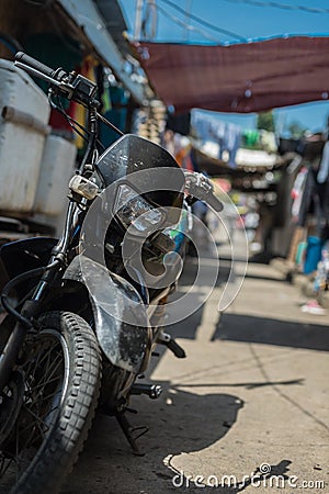 Motorbike standing in an ally Stock Photo