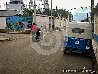 Motorbike and Taxi in San Pedro Apostal, Oaxaca Editorial Stock Photo