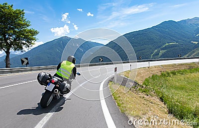 Motorbiker is riding his motorcycle bike Stock Photo