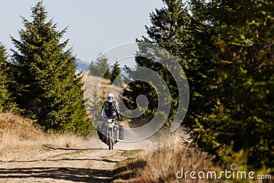 Motorbiker travelling in autumn mountains Stock Photo