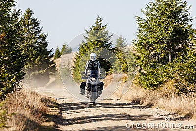 Motorbiker travelling in autumn mountains Stock Photo