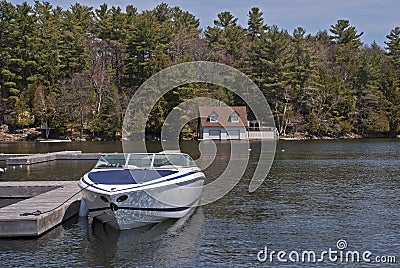 Motorboat docked on a lake Stock Photo