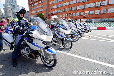 Motorcade of police motorcyclists is accompanied by a bicycle parade Editorial Stock Photo