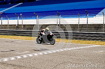 Black Motorcycle Arriving Finish Line, Victory, Motor Sports Editorial Stock Photo