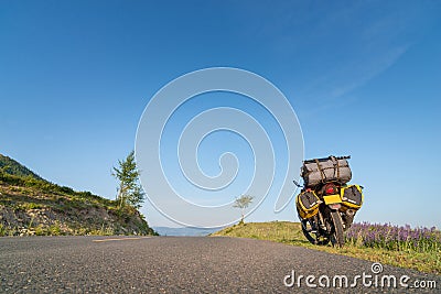 Motorcycle with baggage parking next to the roadside Stock Photo