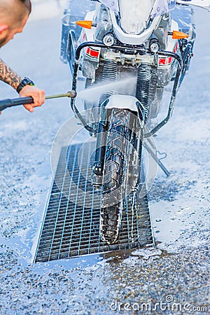 Motorcycle Car Wash Motorcycle Big Bike cleaning with foam injection Stock Photo