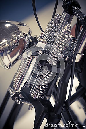 Motorcycle chrome headlight and front suspension Stock Photo