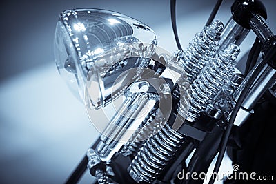 Motorcycle chrome headlight and front suspension Stock Photo