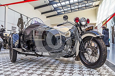 Motorcycle of the Deluxe brand intended for the police is on display in a large trading floor Editorial Stock Photo