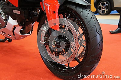 Motorcycle disk brakes are required to provide more grip to the tires and enable the riders to stop during an emergency. Editorial Stock Photo