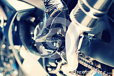 Motorcycle engine with model high heel boots Stock Photo