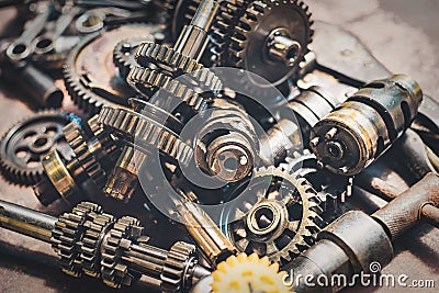 Motorcycle engine part , old Transmission Gears on rusty background . selective focus Stock Photo