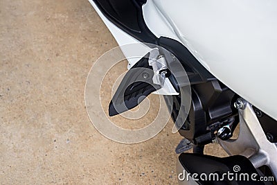 Motorcycle modern steel footrest or pedal,close up Stock Photo