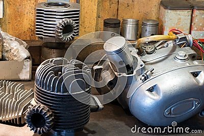 Motorcycle parts and tools on the desktop in garage Stock Photo