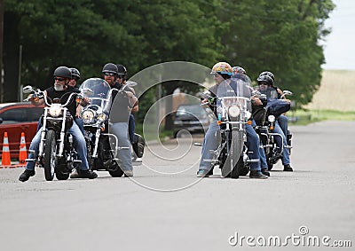 Motorcycle Poker Run Riders on a street talking Editorial Stock Photo