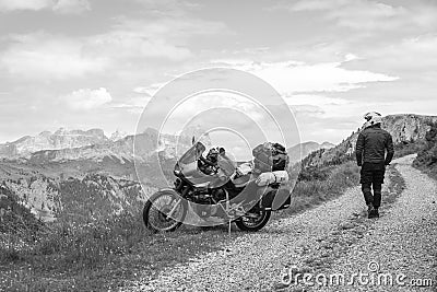 Motorcycle rider enjoy the momment. Touring adventure motorbike on the top of mountain, enduro, off road, beautiful view, black Stock Photo