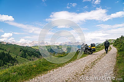 Motorcycle rider enjoy the momment. Touring adventure motorbike on the top of mountain, enduro, off road, beautiful view, danger Stock Photo