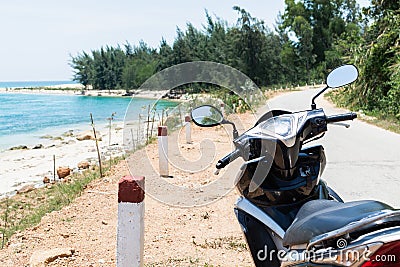 Motorcycle standing on sea shore on the way to Hai Van pass, Vietnam Stock Photo
