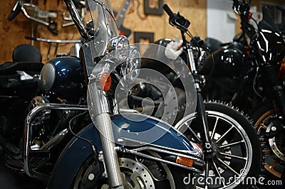 Motorcycles range in garage shop, repaired motorbikes ready for selling Stock Photo