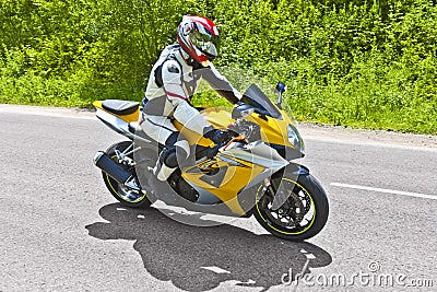 Motorcyclist biker fast riding Stock Photo