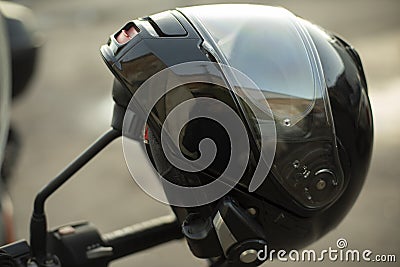 Motorcyclist helmet. Black helmet on motorcycle. Security tool Stock Photo