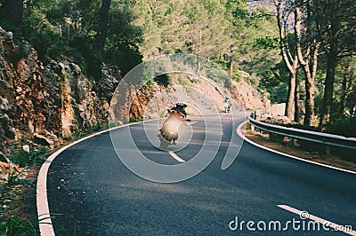 Motorcyclist on mountainous road, enjoying tour along Mallorca, summertime activities, wonderful mountain landscape, extreme Stock Photo