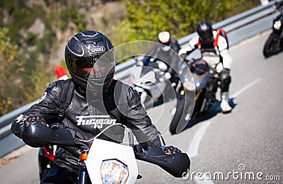 Motorcyclist racers in alps Editorial Stock Photo
