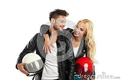 Motorcyclists couple with helmets in hand Stock Photo