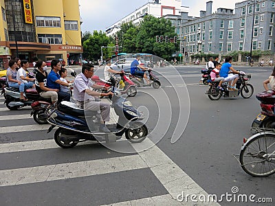 Motorcyclists Crossing the Street Editorial Stock Photo