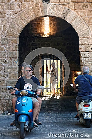 Motorcyclists at the gates of ancient Rhodes city Editorial Stock Photo