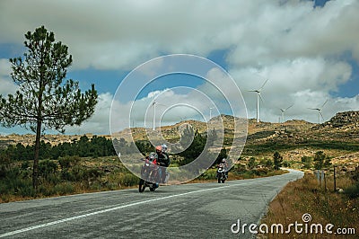 Motorcyclists passing by on the road Editorial Stock Photo