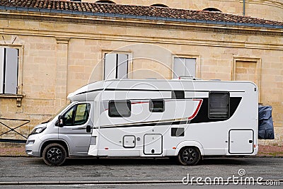 Motorhome camper van parked in traditional street houses in Bordeaux France Stock Photo