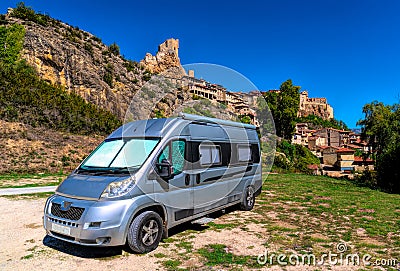 Motorhome parked in beautiful Spanish aire view to hilltop castle and church in Frias Editorial Stock Photo