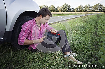 Motorist with empty petrol can Stock Photo