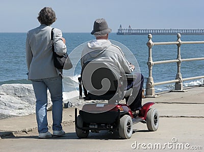 Motorized wheelchair user Stock Photo