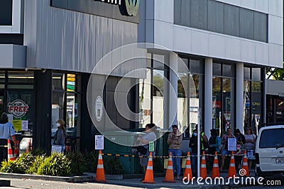 Motueka, South Island, New Zealand, April 2 2020 A queue outside the supermarket in Motueka, New Zealand showing social distancing Editorial Stock Photo