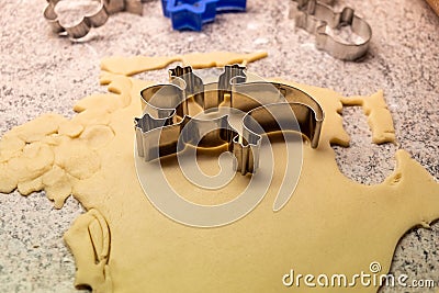 Moulds, hearts, flour and dough for Christmas biscuits Stock Photo