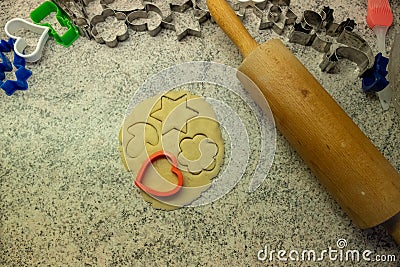 Moulds, hearts, flour and dough for Christmas biscuits Stock Photo