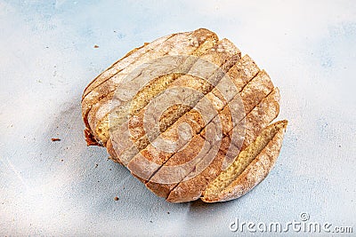 Mouldy moldy bread. Mould growing old bread on wooden table. Wastage of bread and stale bread Stock Photo