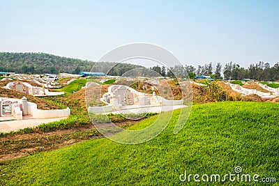 Mound and slope grass graves Stock Photo