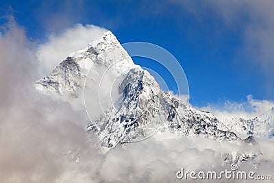 Mount Ama Dablam within clouds, way to Everest base camp Stock Photo