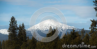 Mount Bachelor snow cap on a partially cloudy day Stock Photo
