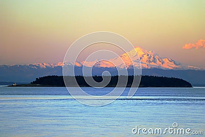 Mount Baker and Patos Island in Evening Light, Washington State, USA, from East Point on Saturna Island, British Columbia, Canada Stock Photo