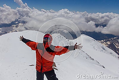 2014 07 Mount Elbrus, Russia: Man rejoices at the top of Mount Elbrus Editorial Stock Photo