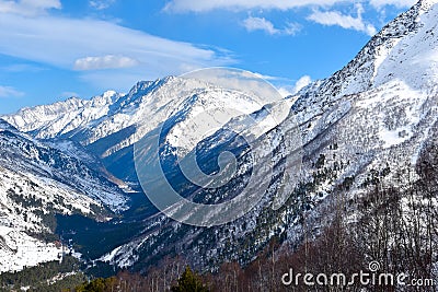 Mount Elbrus with ski slopes. Caucasus snowy mountains. Alpine skiing in the fresh air. skiers in the snow. mountain snowy landsca Stock Photo