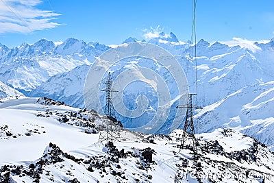 Mount Elbrus with ski slopes. Caucasus snowy mountains. Alpine skiing in the fresh air. skiers in the snow. mountain snowy landsca Stock Photo