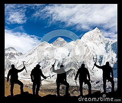 Mount Everest and silhouette of climbing men Stock Photo