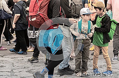 Young asian boys waiting at Fuji base camp station 5 Editorial Stock Photo