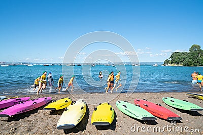 Children developing water confidence and skills by Mount Maunganui Surf Lifeguard Club Editorial Stock Photo